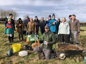 Group of volunteers on a maintenance day at the community orchard